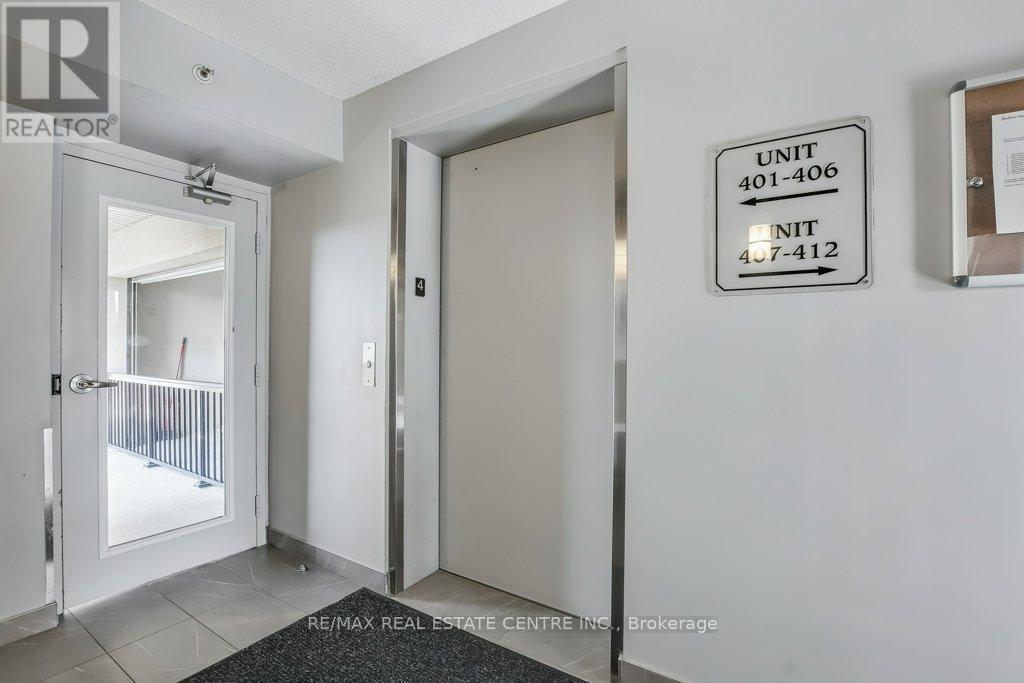 407 - 1479 Maple Avenue, Milton, Ontario  L9T 0B5 - Photo 4 - W12432089