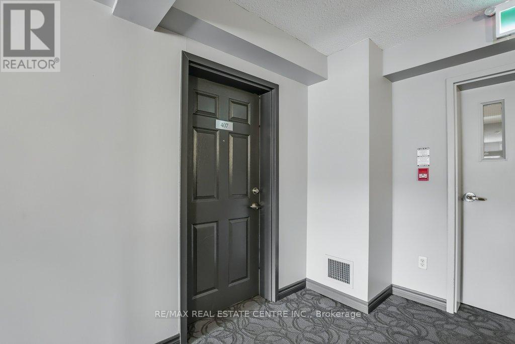407 - 1479 Maple Avenue, Milton, Ontario  L9T 0B5 - Photo 5 - W12432089