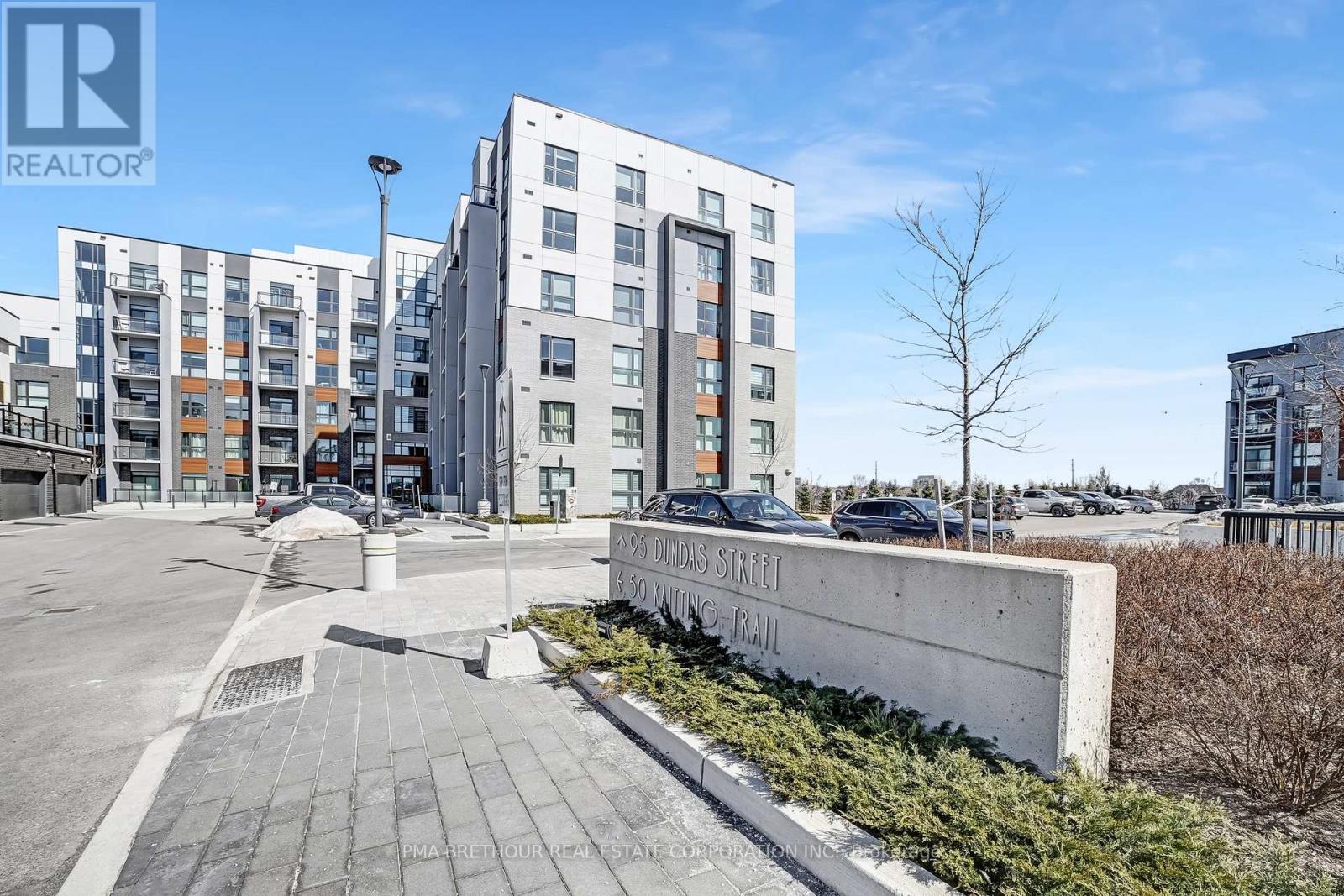 101 - 50 Kaitting Trail, Oakville, Ontario  L6M 5N3 - Photo 2 - W12432942