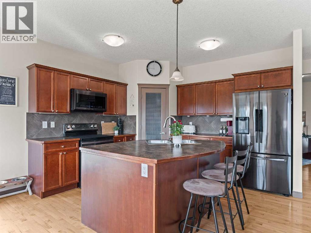 95 Crystal Shores Road, Okotoks, Alberta  T1S 2H9 - Photo 12 - A2244699