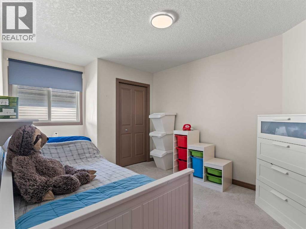 95 Crystal Shores Road, Okotoks, Alberta  T1S 2H9 - Photo 20 - A2244699
