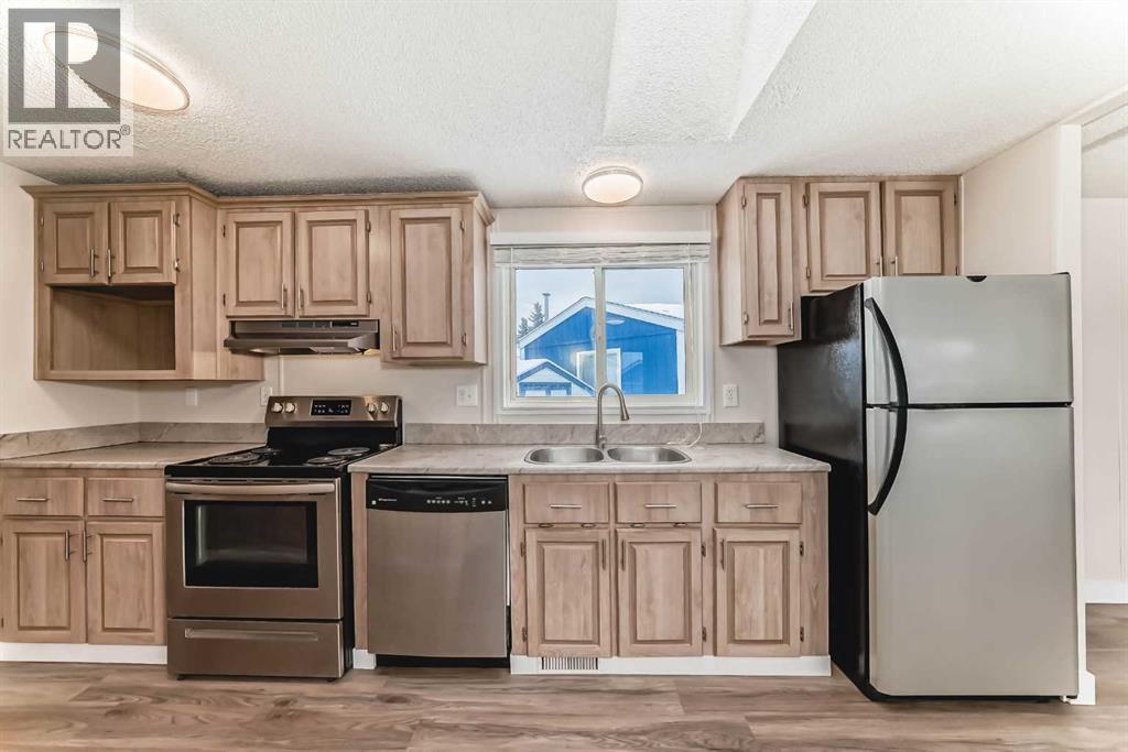 203 Burroughs Circle Ne, Calgary, Alberta  T1Y 6K8 - Photo 3 - A2252897