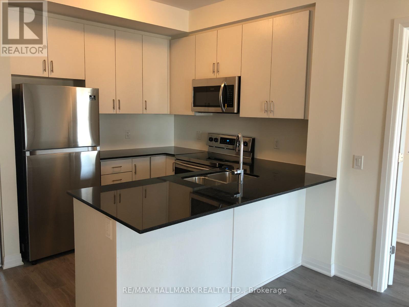 110 - 128 Grovewood Common, Oakville, Ontario  L6H 0X3 - Photo 3 - W12435032
