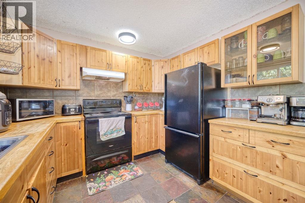 24 Hunters Gate, Okotoks, Alberta  T1S 1K9 - Photo 7 - A2260468