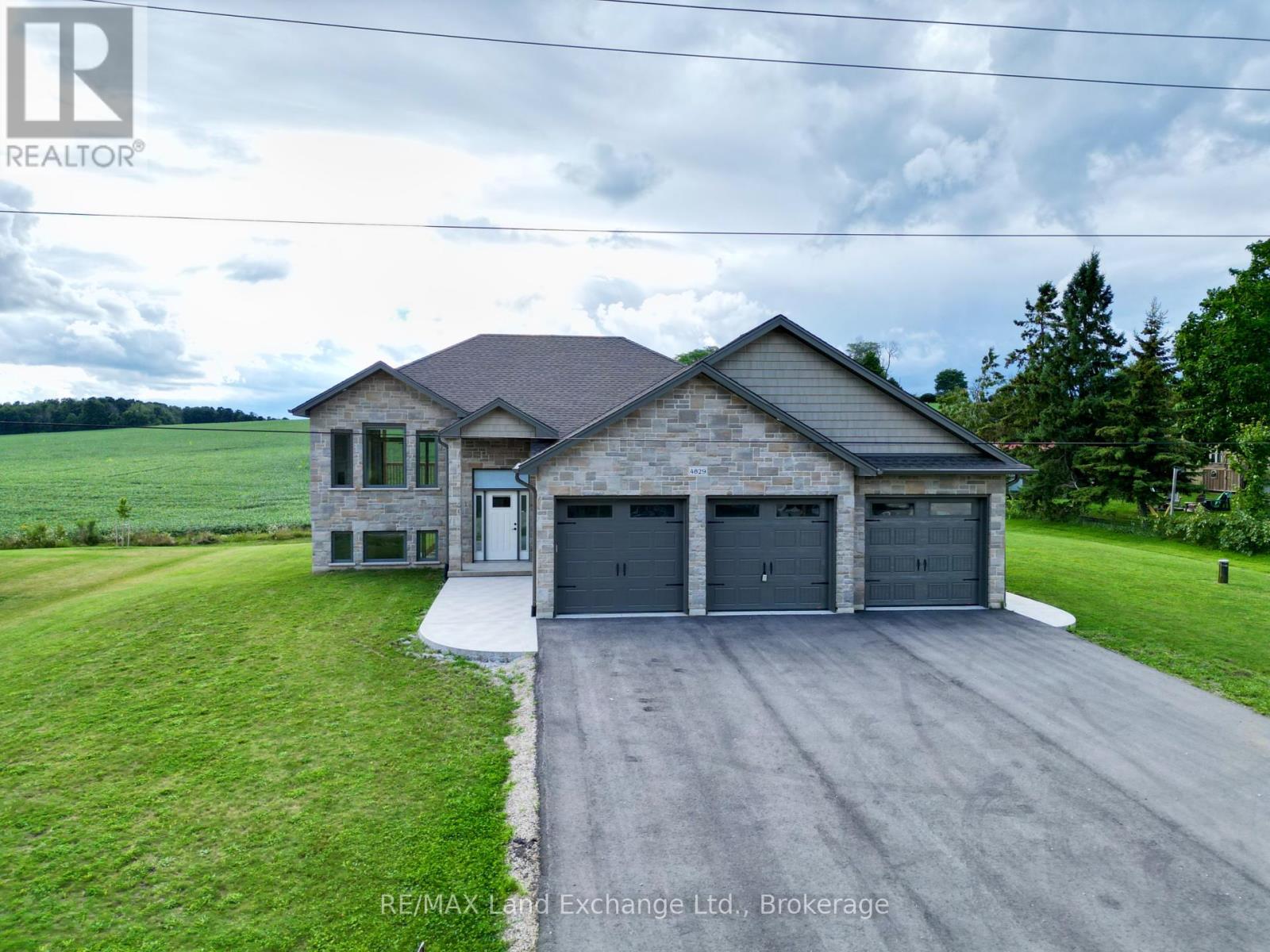 The 1325 sqft raised bungalow with finished walkout basement and 3 car garage in Burgoyne at 4829 Bruce Rd 3, is complete; and available for immediate occupancy. This home has 2 + 2 bedrooms and 3 full baths. Standard features include hardwood & ceramic flooring throughout the main floor, solid wood staircase, Quartz kitchen counters, 2 gas fireplaces; Asphalt drive, sodded yard and more. Added bonus this one comes with 6 appliances and window coverings. HST is in addition to the asking price.  The Builder will co operate with the Buyers to secure the HST rebate provided it is approved by the Government and the Buyer is entitled to it  Prices subject to change without notice. (id:48254)