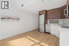 310, 1087 2 Avenue Nw, Calgary, Alberta  T3H 5L9 - Photo 9 - A2261171
