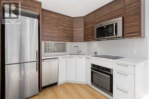 310, 1087 2 Avenue Nw, Calgary, Alberta  T3H 5L9 - Photo 8 - A2261171
