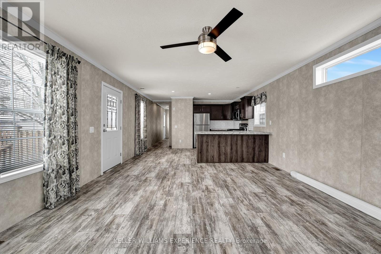 40 Shamrock Crescent, Essa, Ontario  L3W 0A5 - Photo 7 - N12439712