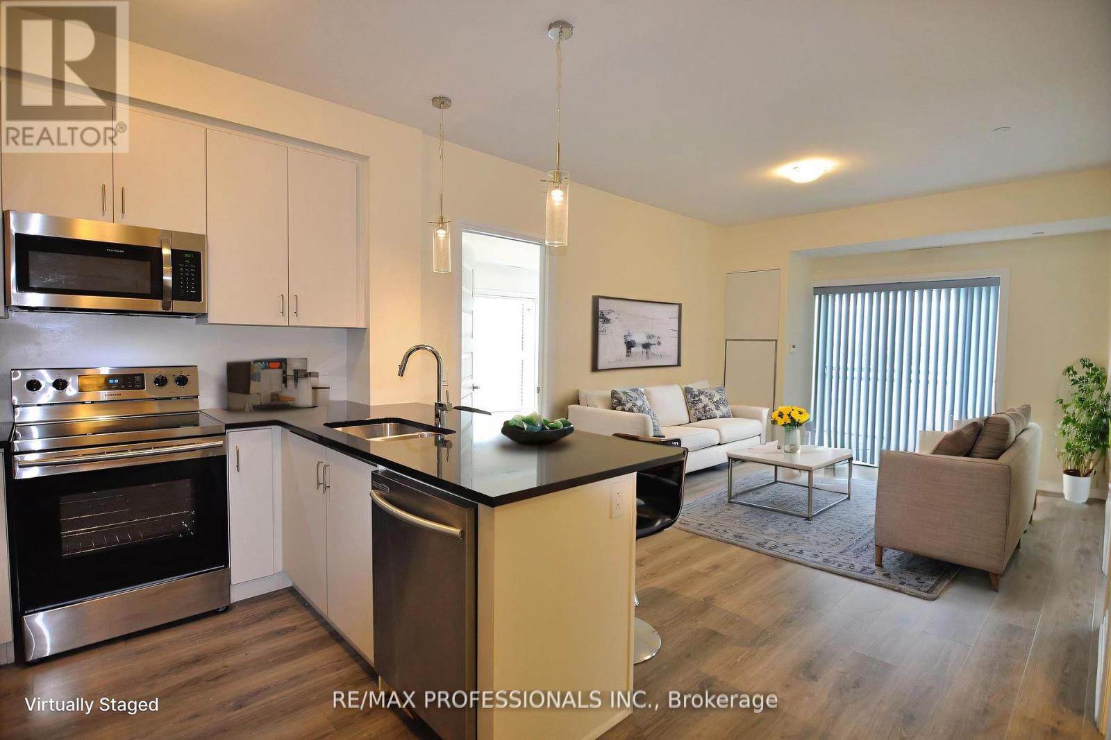 210 - 128 Grovewood Common, Oakville, Ontario  L6H 0X3 - Photo 7 - W12439833