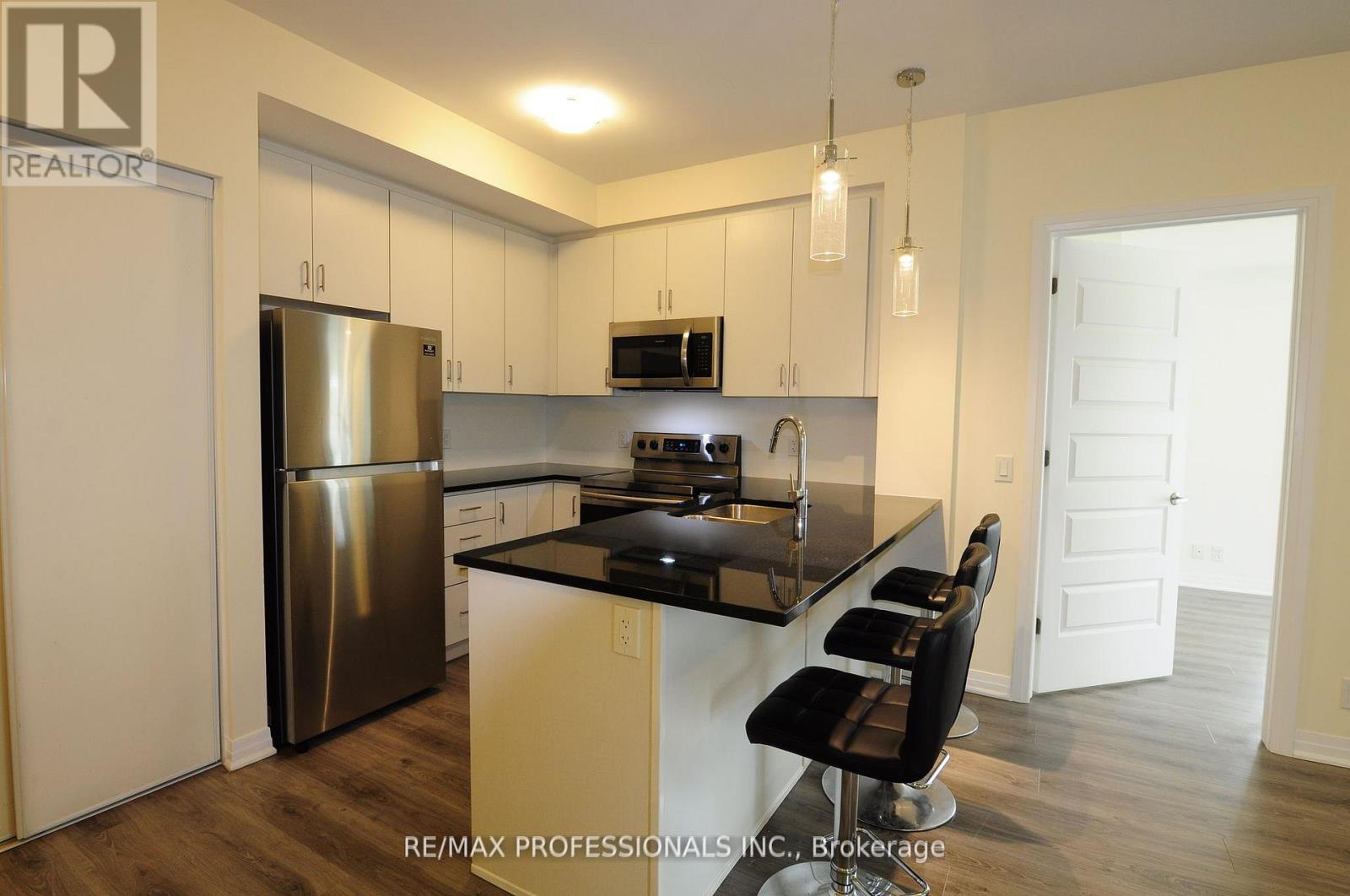 210 - 128 Grovewood Common, Oakville, Ontario  L6H 0X3 - Photo 8 - W12439833