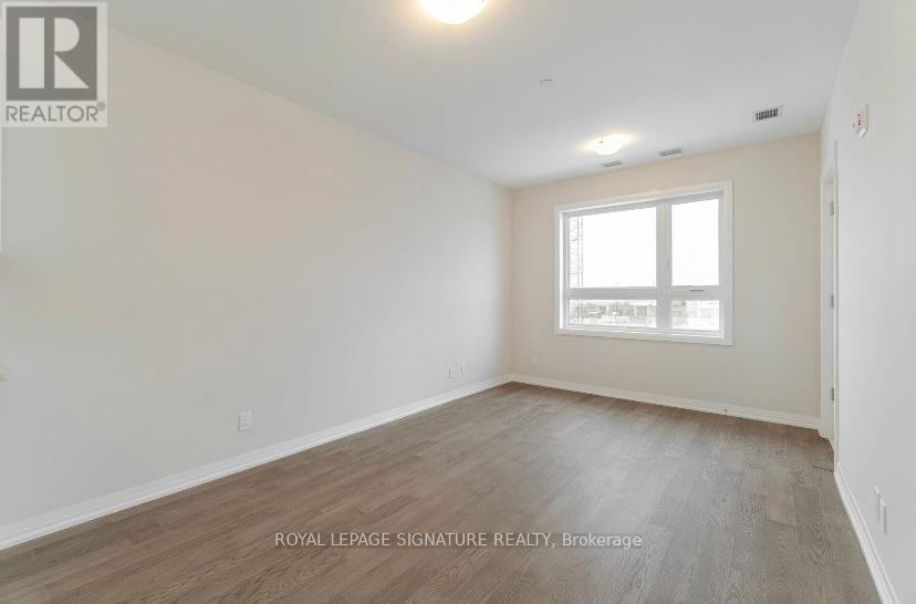 215 - 3265 Carding Mill Trail, Oakville, Ontario  L6M 1S1 - Photo 3 - W12438876