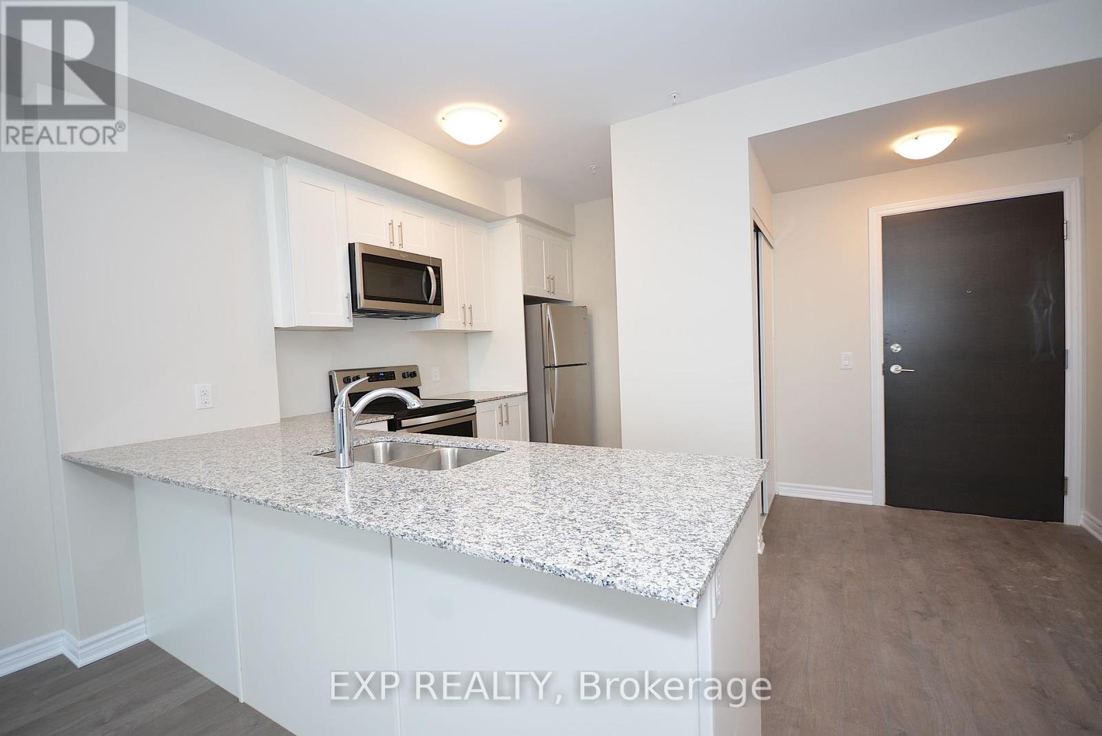 316 - 150 Oak Park Boulevard, Oakville, Ontario  L6H 0E7 - Photo 2 - W12440739