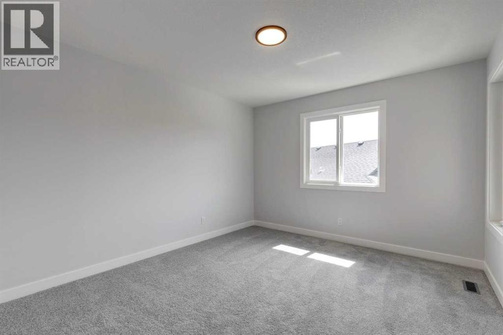 9 Wedderburn Gate, Okotoks, Alberta  T1S 5X2 - Photo 6 - A2257301