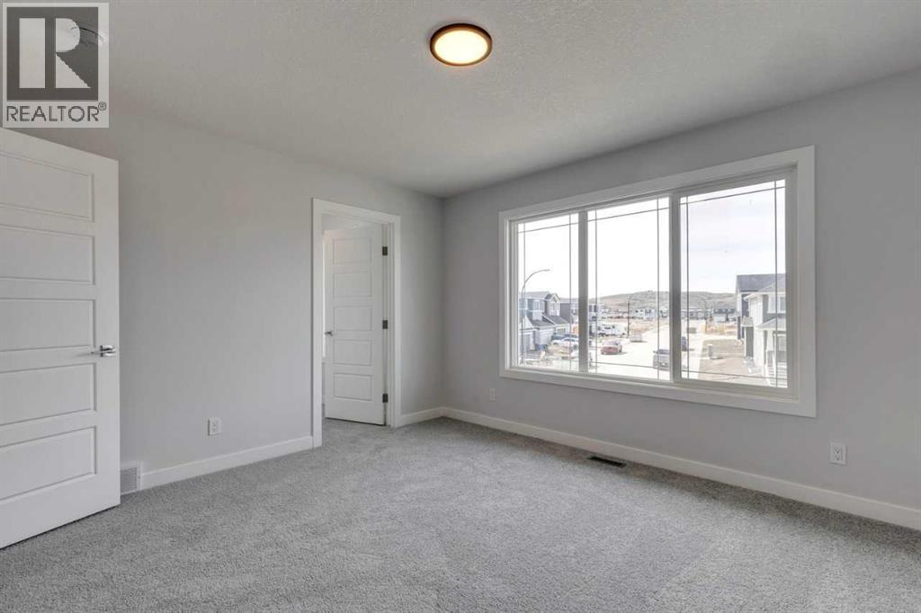 9 Wedderburn Gate, Okotoks, Alberta  T1S 5X2 - Photo 8 - A2257301