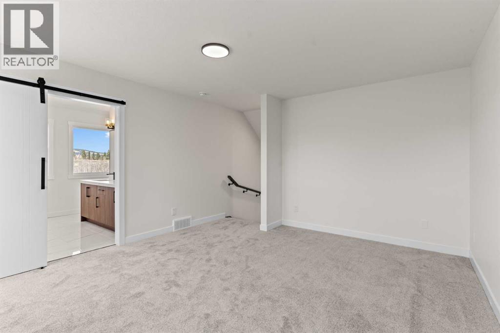 48 Cottageclub Lane, Rural Rocky View County, Alberta  T4C 1B1 - Photo 19 - A2221288