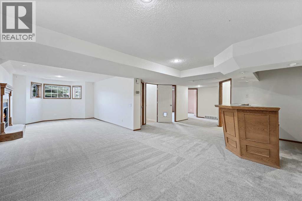 87 Quigley Drive, Cochrane, Alberta  T4C 1L5 - Photo 23 - A2261383