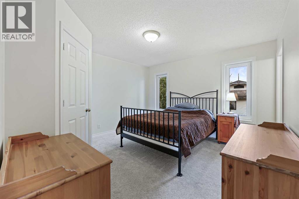 87 Quigley Drive, Cochrane, Alberta  T4C 1L5 - Photo 13 - A2261383