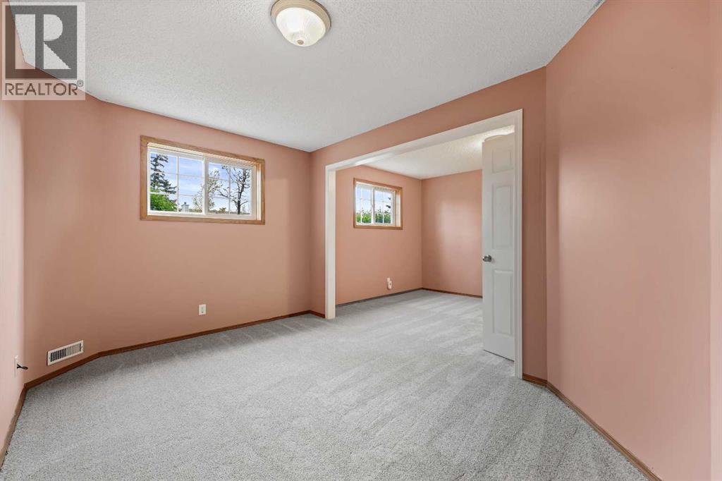 87 Quigley Drive, Cochrane, Alberta  T4C 1L5 - Photo 27 - A2261383