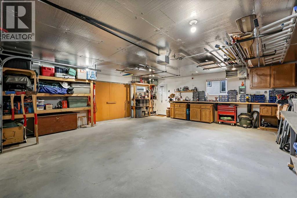 87 Quigley Drive, Cochrane, Alberta  T4C 1L5 - Photo 41 - A2261383