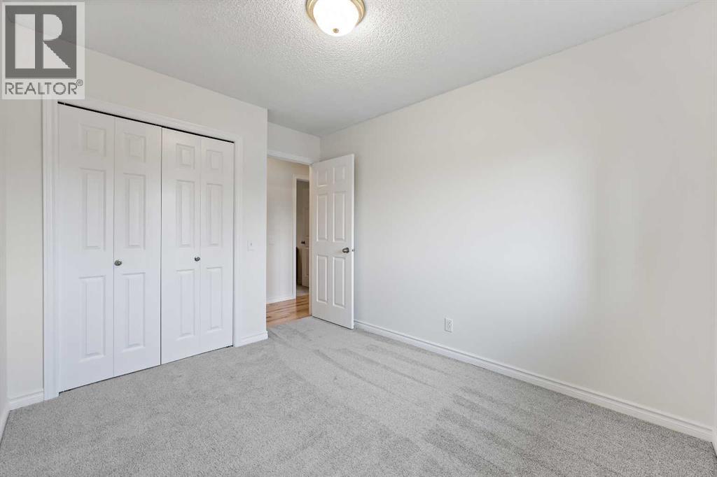 87 Quigley Drive, Cochrane, Alberta  T4C 1L5 - Photo 17 - A2261383