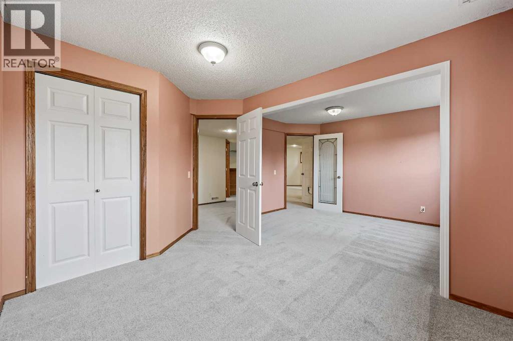 87 Quigley Drive, Cochrane, Alberta  T4C 1L5 - Photo 28 - A2261383