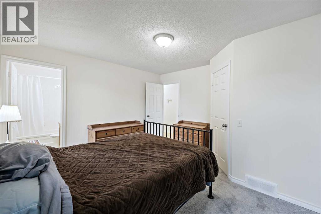 87 Quigley Drive, Cochrane, Alberta  T4C 1L5 - Photo 14 - A2261383