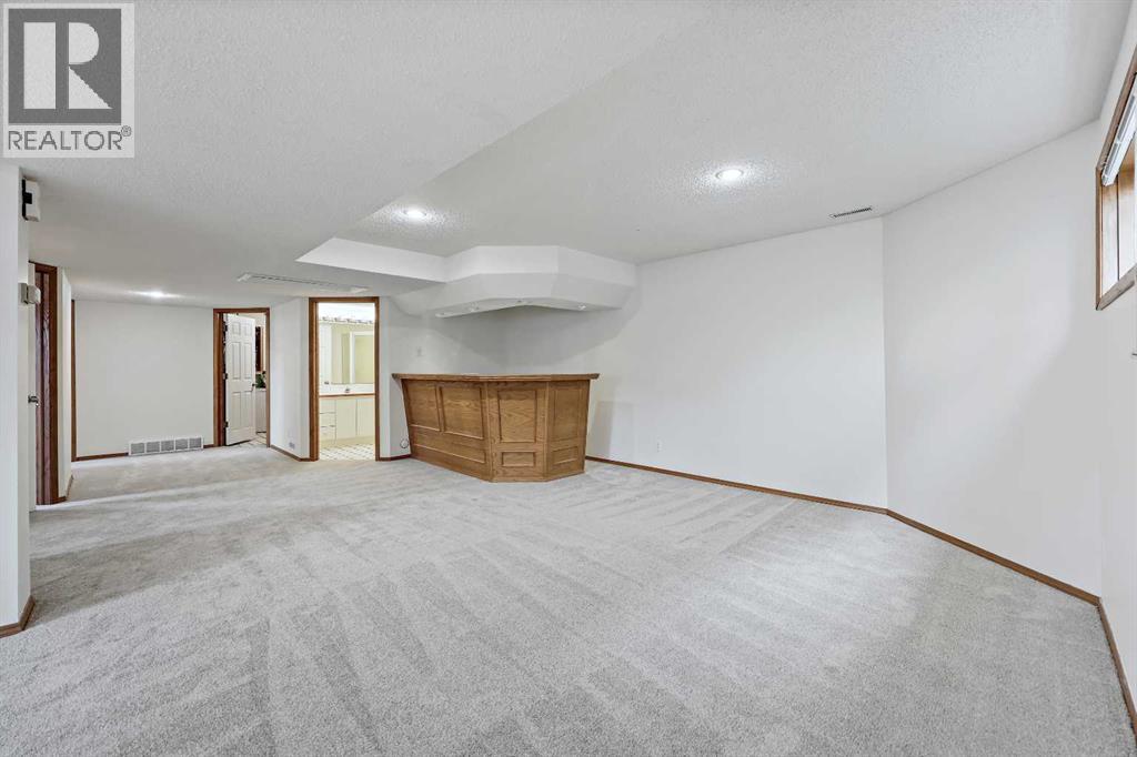 87 Quigley Drive, Cochrane, Alberta  T4C 1L5 - Photo 25 - A2261383