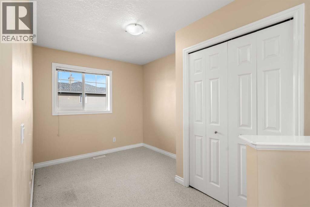 70 Crystal Shores Cove, Okotoks, Alberta  T1S 2B4 - Photo 13 - A2260860