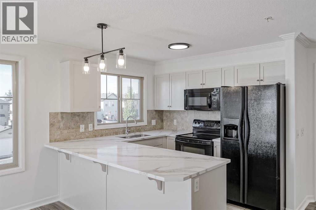 1304, 92 Crystal Shores Road, Okotoks, Alberta  T1S 2M8 - Photo 1 - A2258956