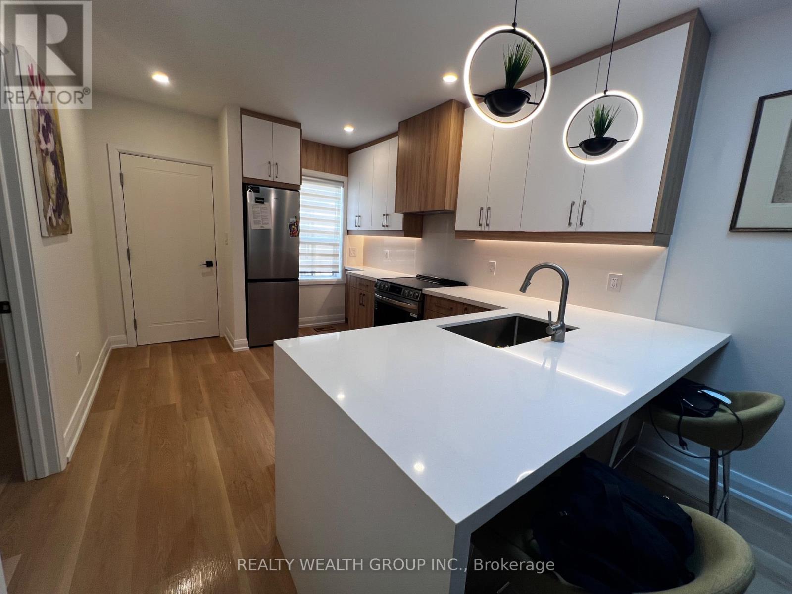 166 Harvie Avenue, Toronto, Ontario  M6E 4K3 - Photo 4 - W12443009