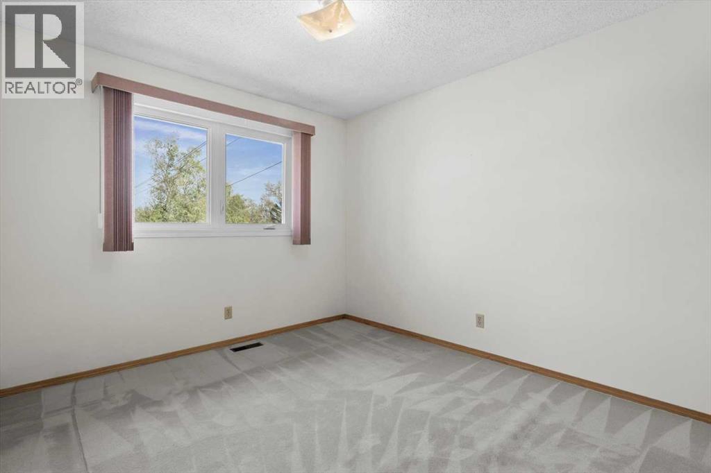 112 Nottingham Road Nw, Calgary, Alberta  T2K 5L8 - Photo 24 - A2261478