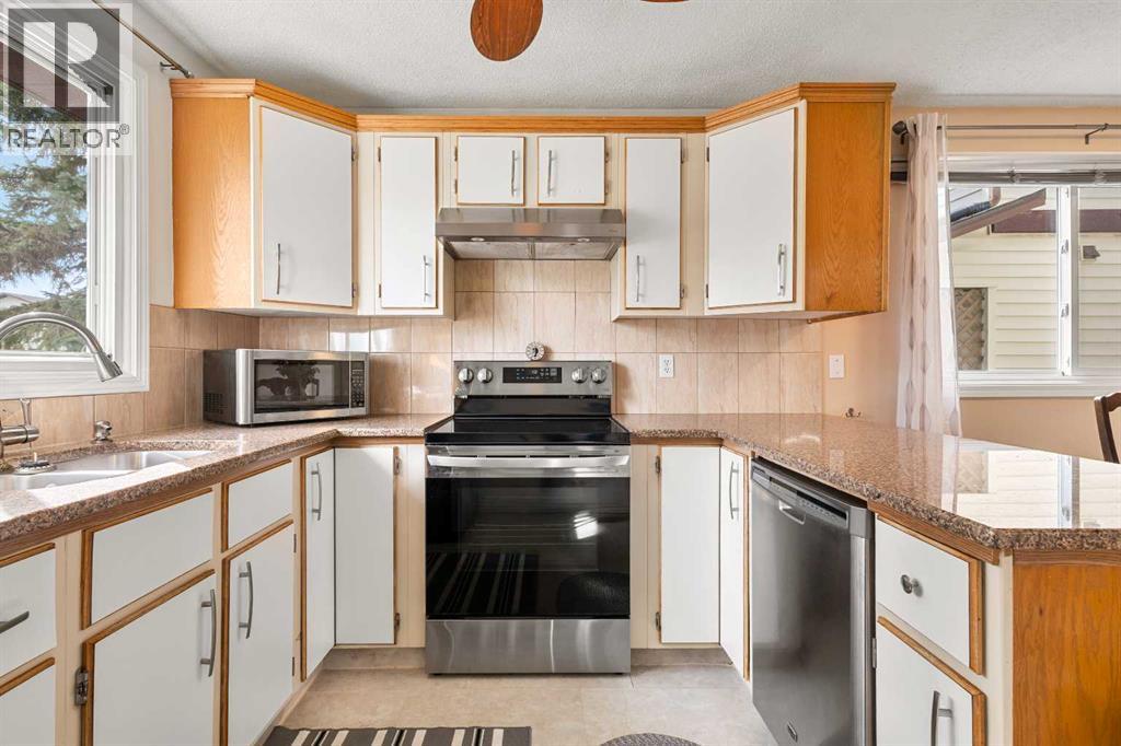 211 Abalone Place Ne, Calgary, Alberta  T2A 6S2 - Photo 7 - A2261773