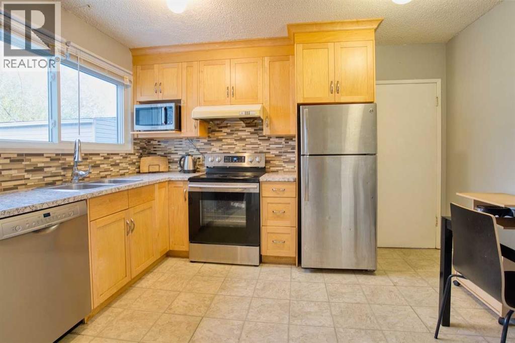 417 Goddard Avenue Ne, Calgary, Alberta  T2K 3T8 - Photo 9 - A2261922