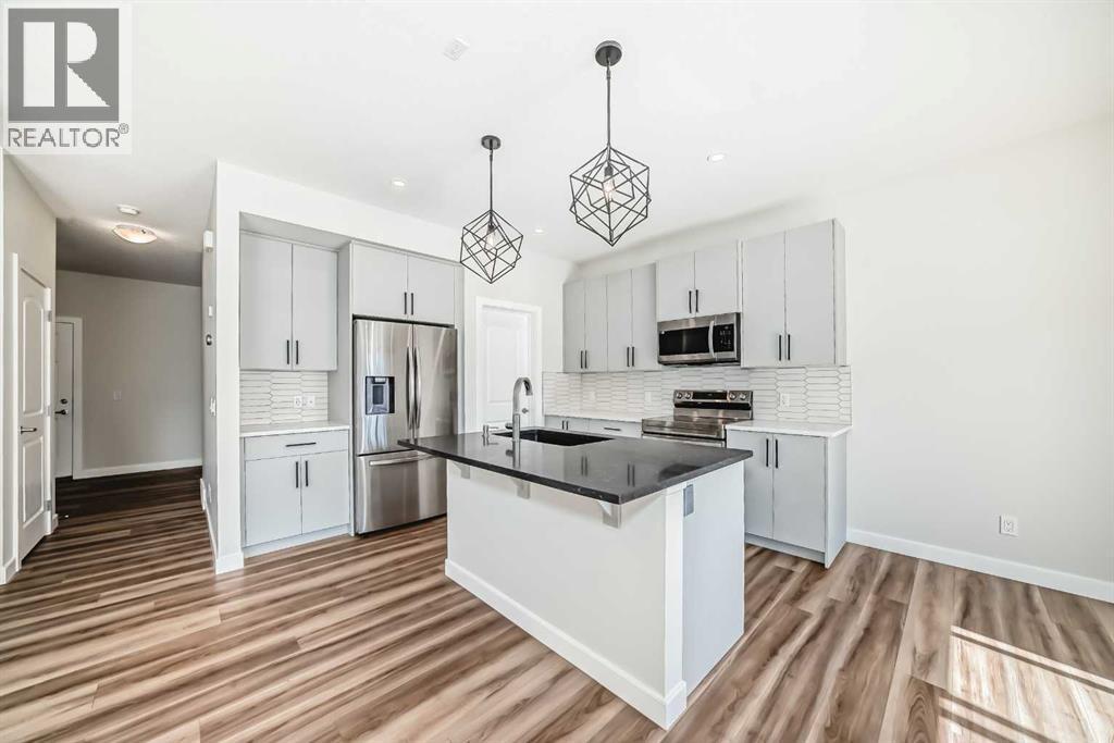 105 Creekside Way Sw, Calgary, Alberta  T2X 4A9 - Photo 4 - A2257749