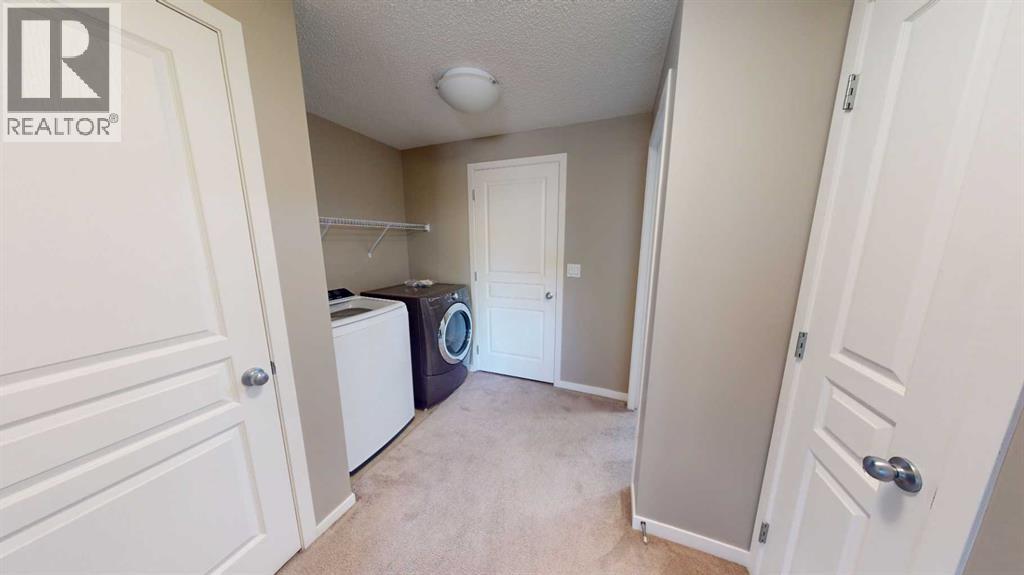 216 New Brighton Grove Se, Calgary, Alberta  T2Z 1G2 - Photo 6 - A2246047