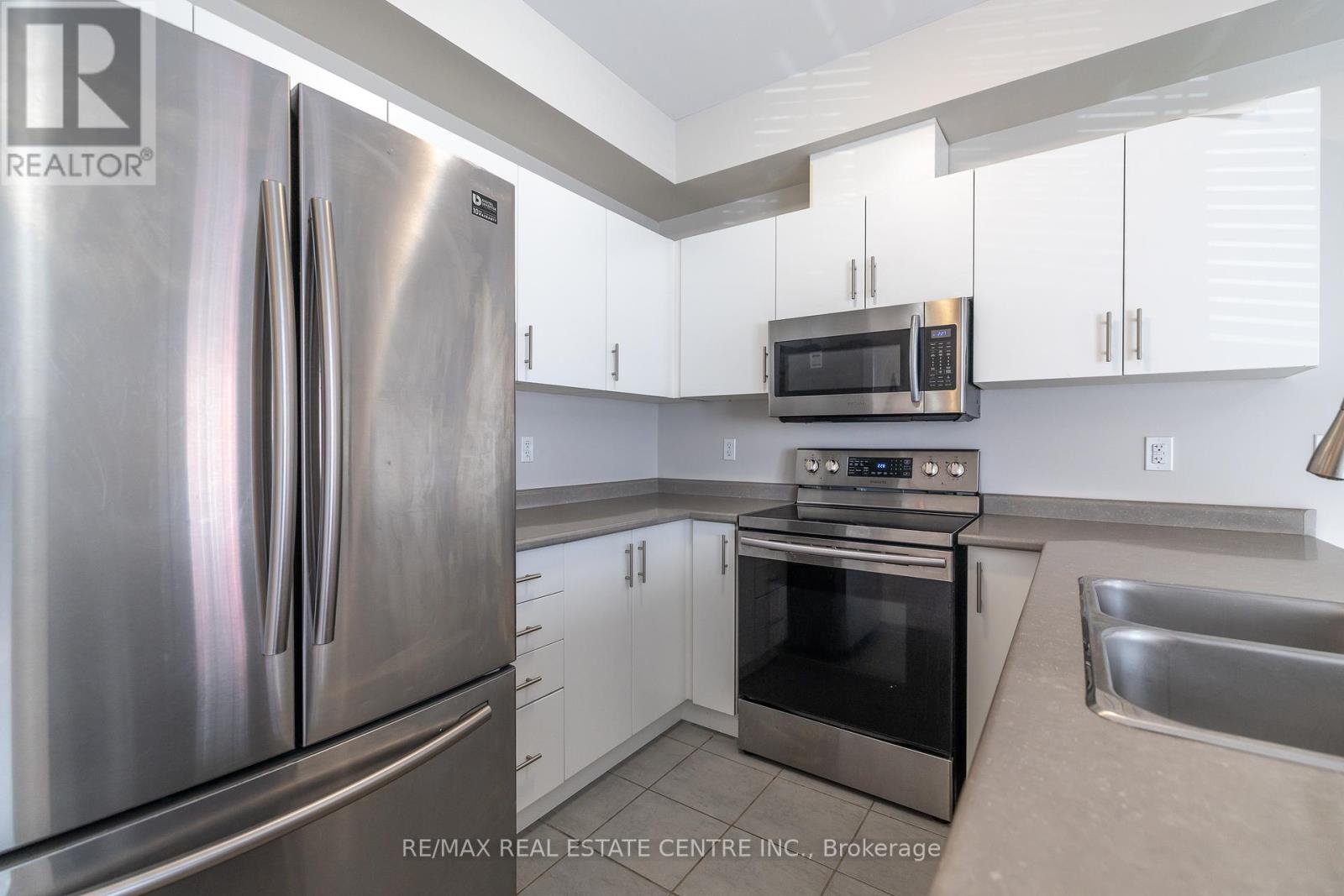 80 - 88 Decorso Drive, Guelph, Ontario  N1L 0A1 - Photo 6 - X12445916