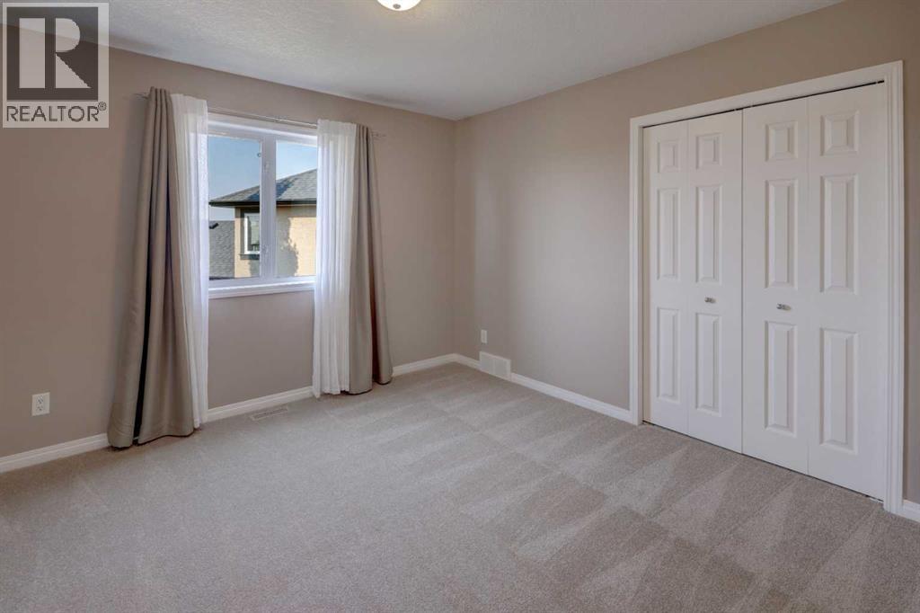 99 Hidden Creek Point Nw, Calgary, Alberta  T3A 6J7 - Photo 31 - A2257857