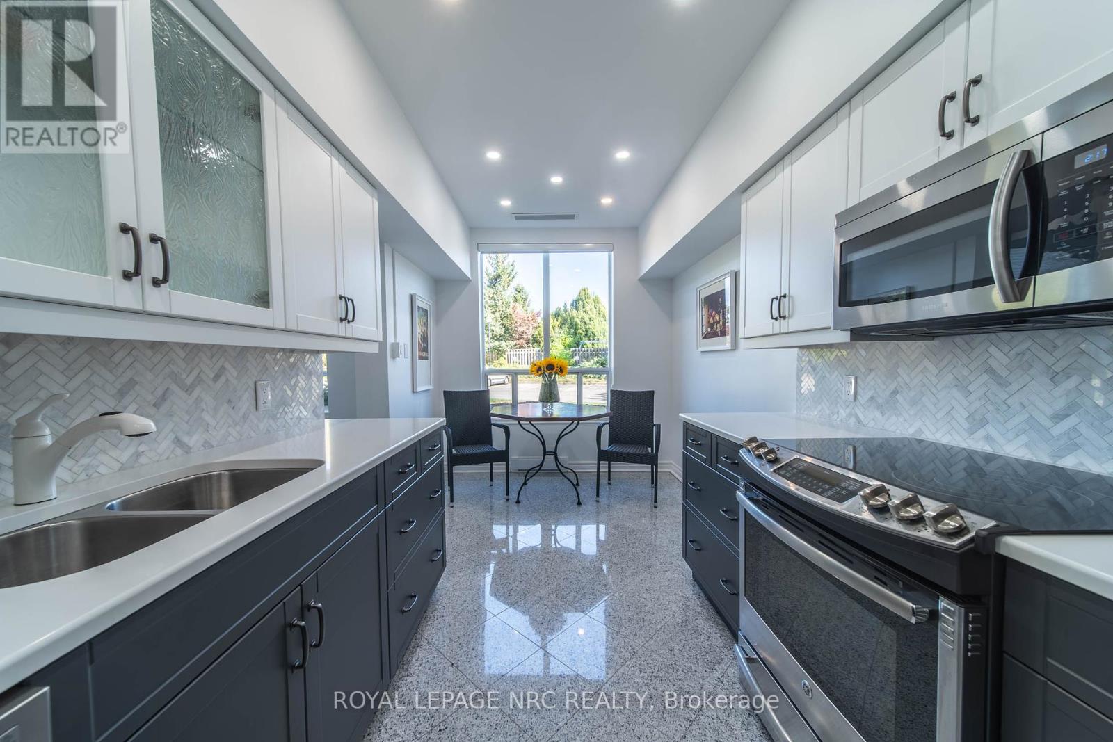 107 - 8111 Forest Glen Drive, Niagara Falls, Ontario  L2H 2Y7 - Photo 4 - X12447306