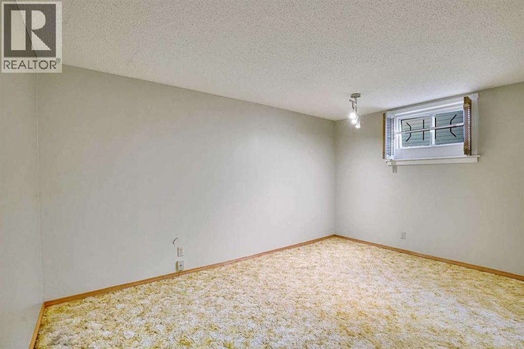 2719 Cedar Ridge Drive Sw, Calgary, Alberta  T2W 1X5 - Photo 30 - A2261869