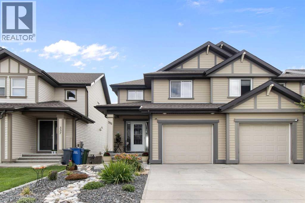 333 Sunset Common, Cochrane, Alberta  T4C 0L8 - Photo 1 - A2245363