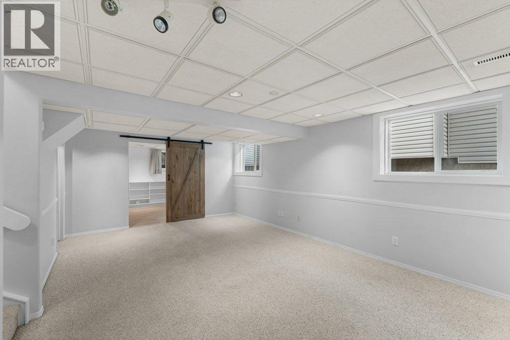 64 Woodmark Crescent Sw, Calgary, Alberta  T2W 4Z2 - Photo 29 - A2262249