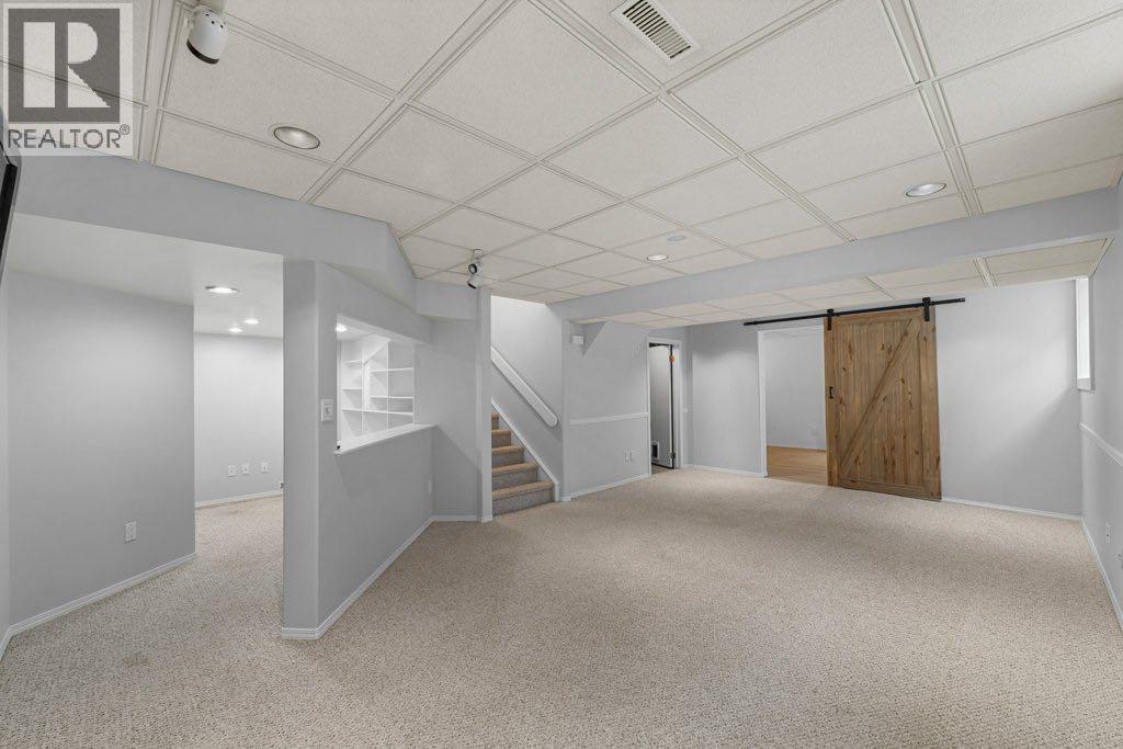 64 Woodmark Crescent Sw, Calgary, Alberta  T2W 4Z2 - Photo 31 - A2262249