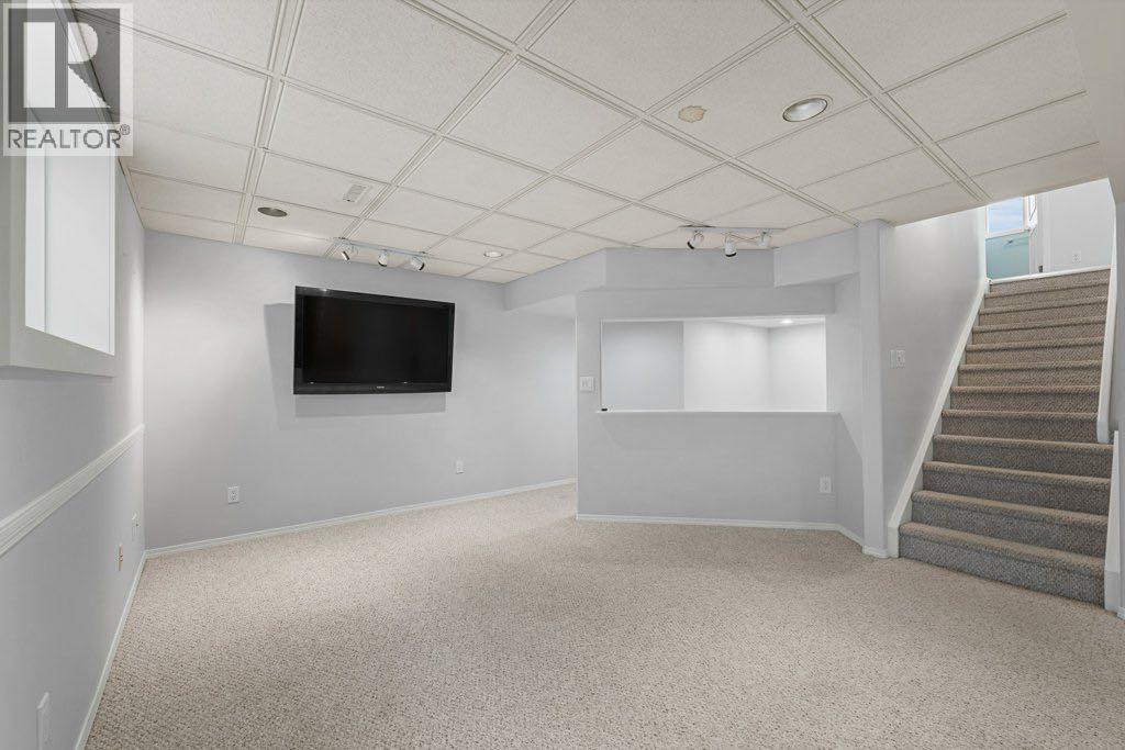 64 Woodmark Crescent Sw, Calgary, Alberta  T2W 4Z2 - Photo 28 - A2262249