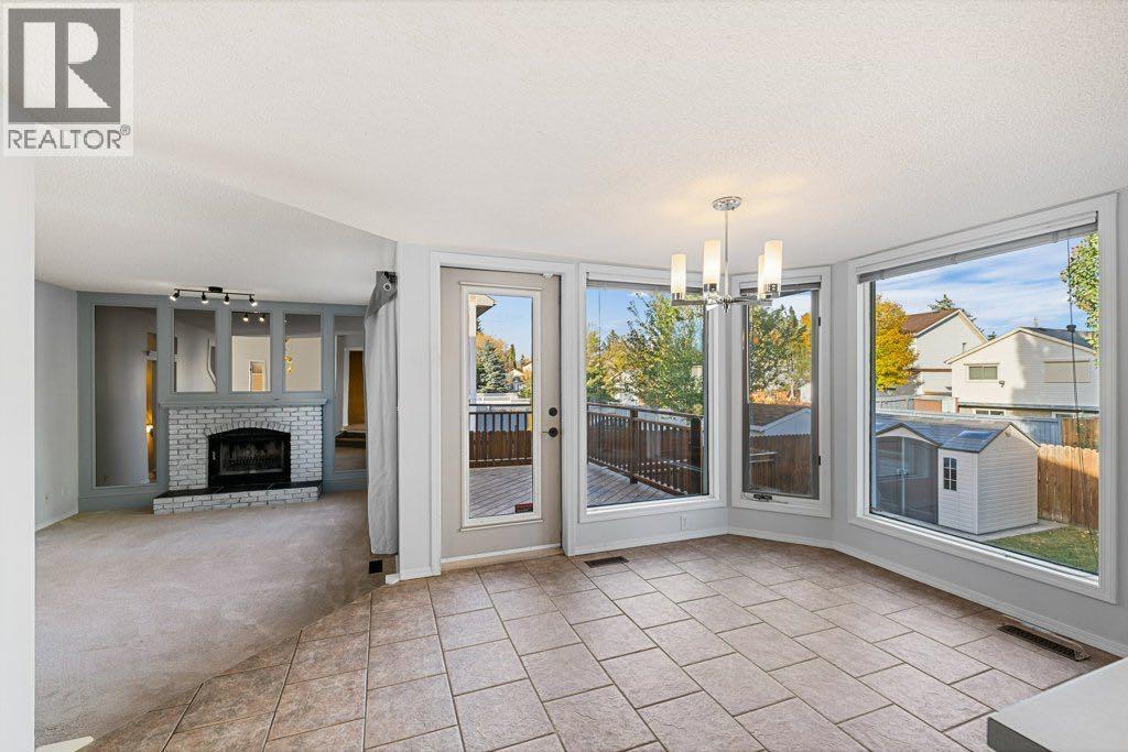 64 Woodmark Crescent Sw, Calgary, Alberta  T2W 4Z2 - Photo 10 - A2262249