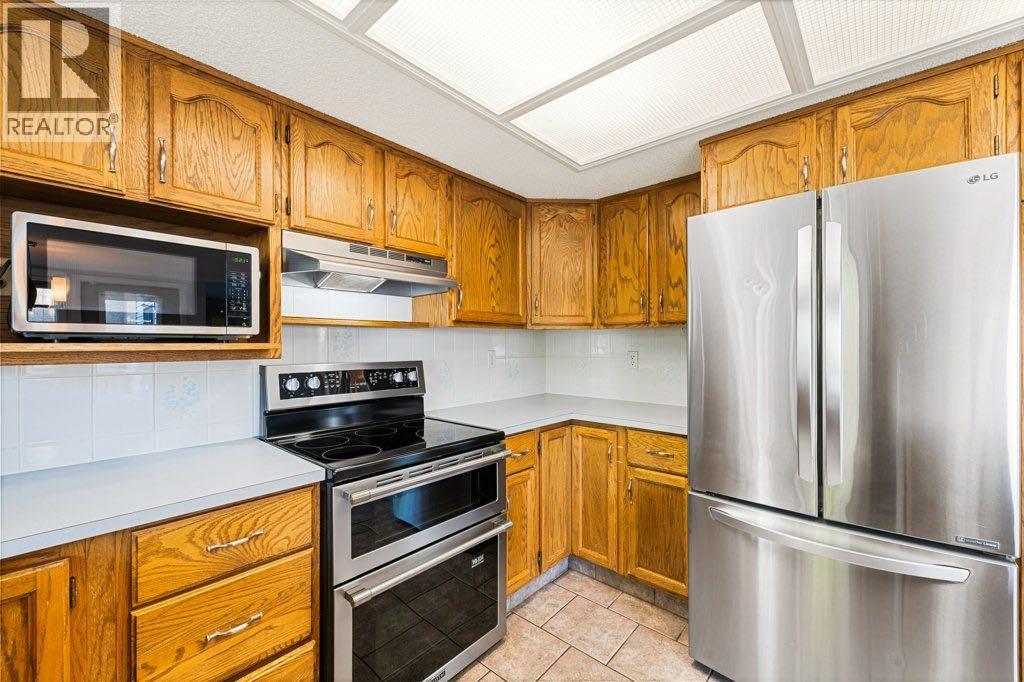 64 Woodmark Crescent Sw, Calgary, Alberta  T2W 4Z2 - Photo 5 - A2262249