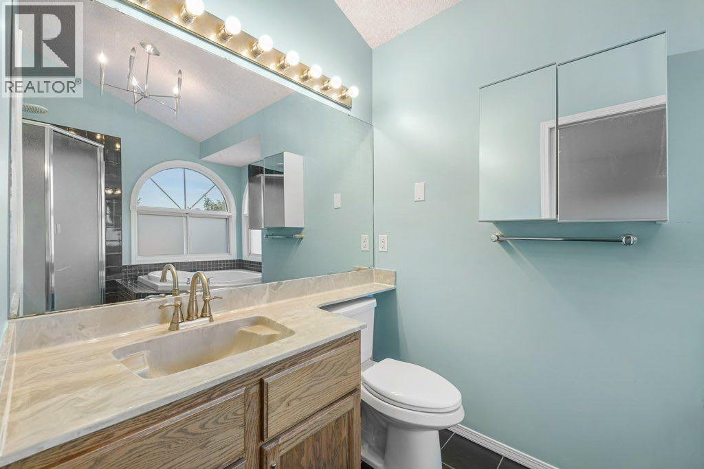 64 Woodmark Crescent Sw, Calgary, Alberta  T2W 4Z2 - Photo 22 - A2262249