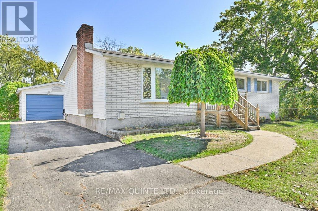 Meticulously maintained 3 bedroom, 2 bath bungalow conveniently located in Trenton's west end. Natural light fills spacious living room. Large kitchen is open to dining area. Warm oak kitchen cabinetry with stainless steel appliances, hardwood flooring. Rear patio door access to deck overlooks private rear yard and gardens. Oversized primary bedroom, 2 additional bedrooms, 4pc bathroom on main level. Lower level is finished, featuring massive rec room with retro bar and natural gas freestanding woodstove, a great space to entertain! Get creative with two flexible room spaces which can be used as an office/gym/games room. Additional 3pc bathroom with shower, laundry with storage space to keep organized. Entertain or relax on large elevated rear deck with BBQ hookup overlooks park-like backyard. Detached single car garage with hydro and workshop space. Roof reshingled 2022, 200amp c/b, shed. Great location walking distance to trails, minutes to downtown, marina, coffee shops, CFB Trenton and Hwy 401. For the commuter, 1.5hrs to GTA and 1 hour to Kingston. (id:48254)