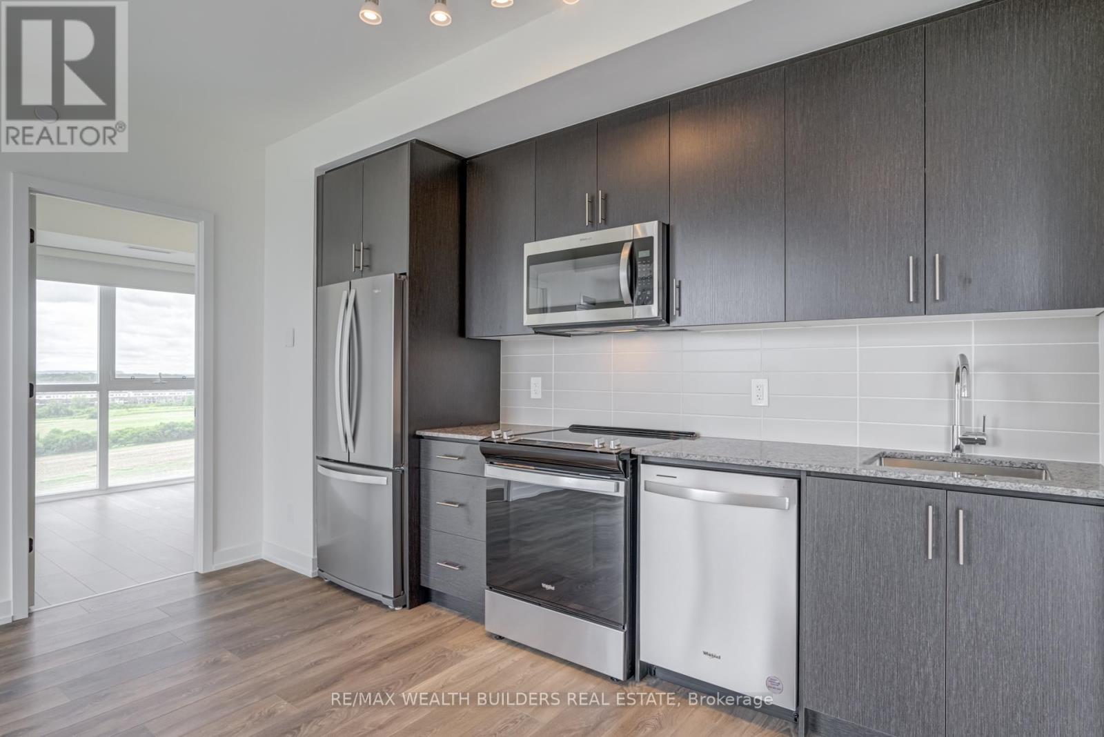 810 - 335 Wheat Boom Drive, Oakville, Ontario  L6H 7C2 - Photo 6 - W12449258