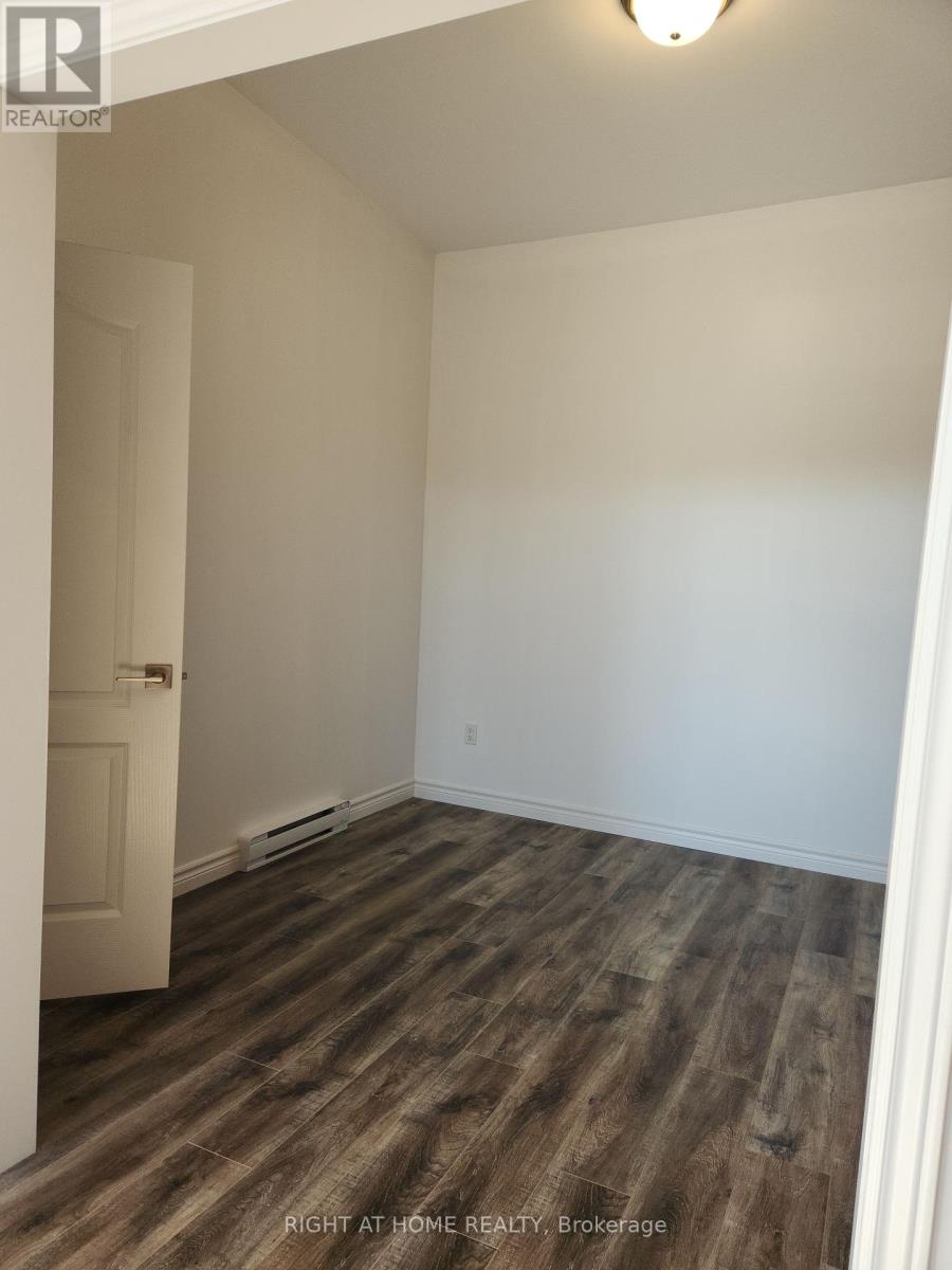 201 - 9 Queen Street W, Springwater, Ontario  L0L 1P0 - Photo 7 - S12449634