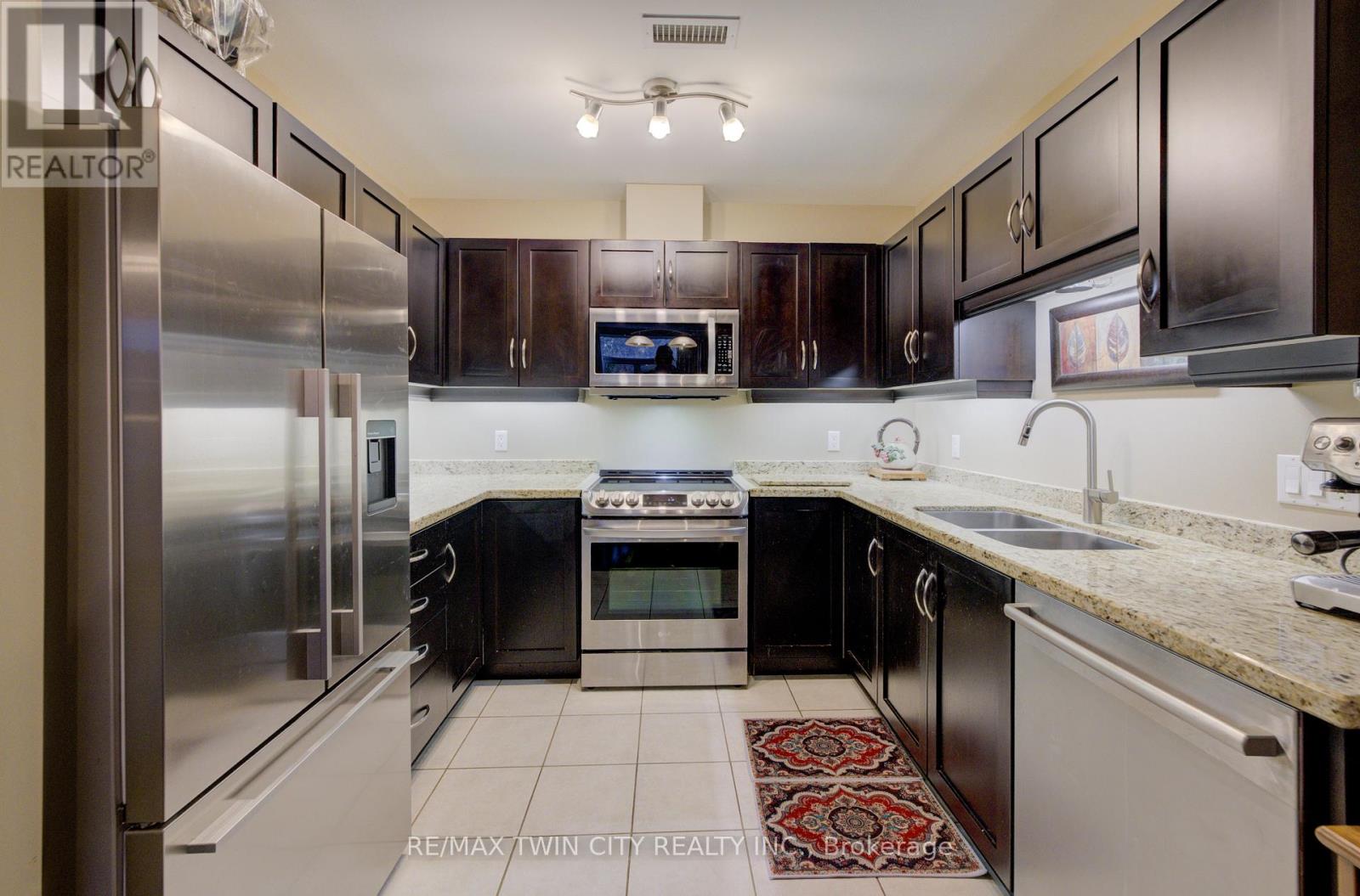 105 - 165 Duke Street E, Kitchener, Ontario  N2H 6T8 - Photo 2 - X12450132